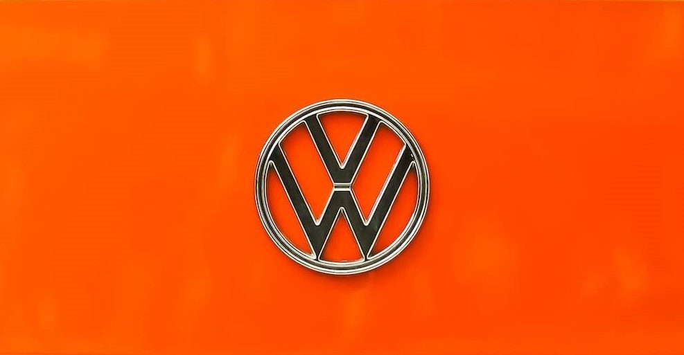 Volkswagen logo on an orange background.